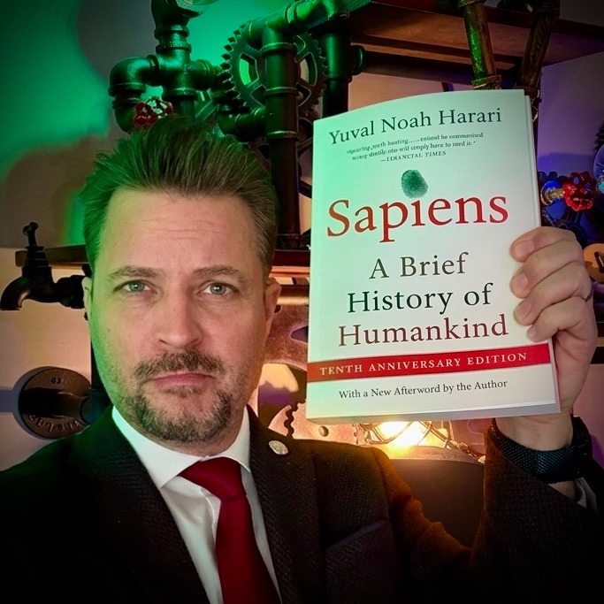 Matt Mishak with Sapiens by Yuval Noah Harari